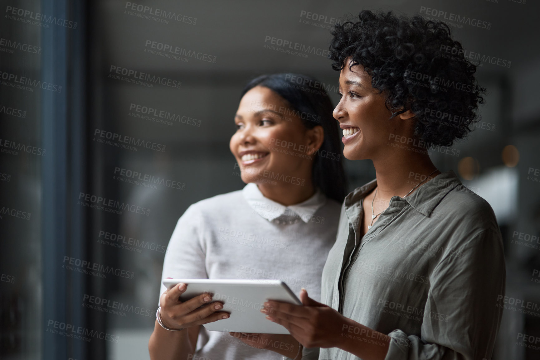 Buy stock photo Shot of Two businesswoman working in a modern office