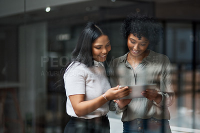 Buy stock photo Shot of Two businesswoman working in a modern office