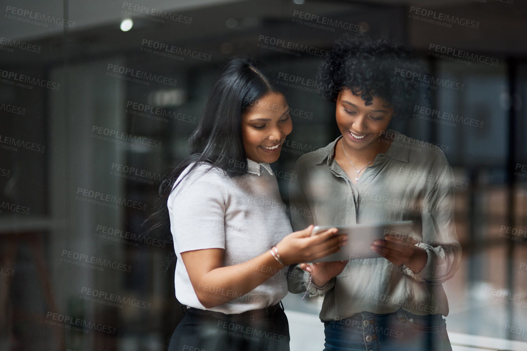 Buy stock photo Shot of Two businesswoman working in a modern office