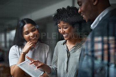 Buy stock photo Shot of three businesspeople working in a modern office