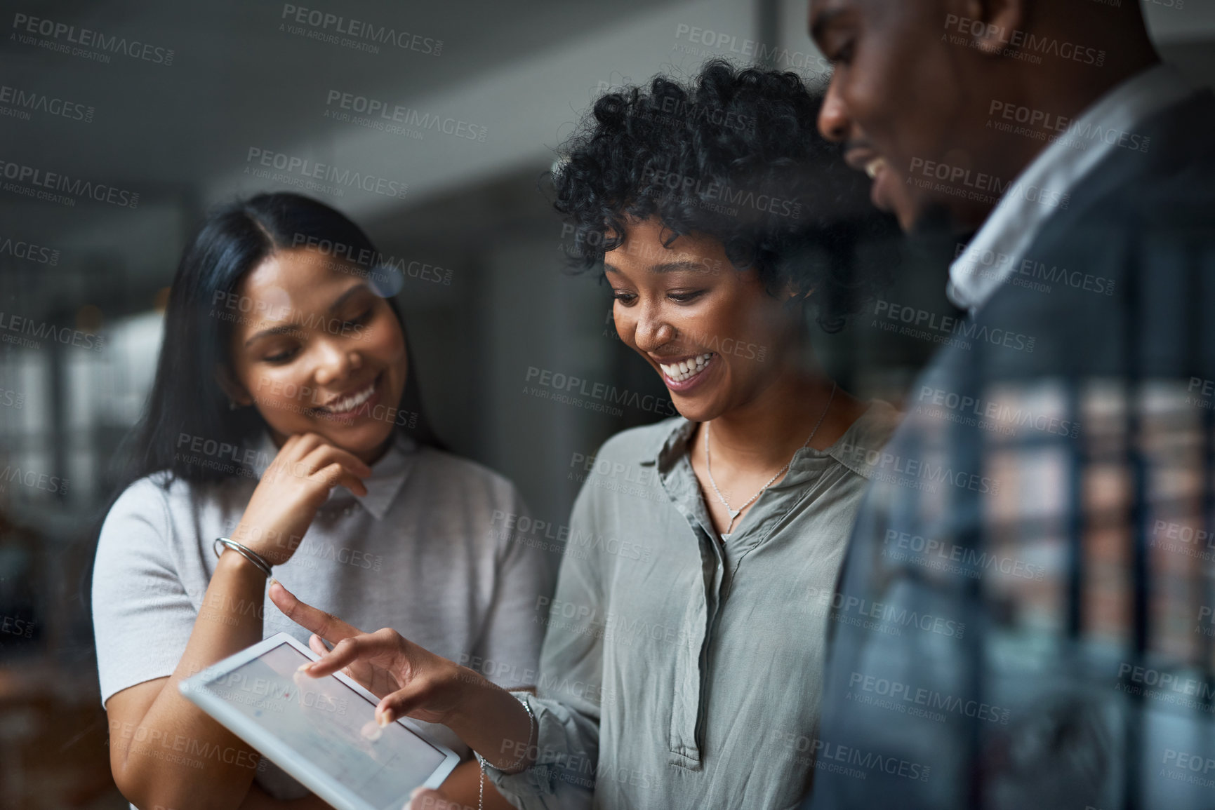 Buy stock photo Shot of three businesspeople working in a modern office