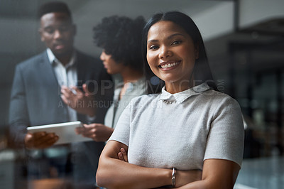 Buy stock photo Shot of three businesspeople working in a modern office