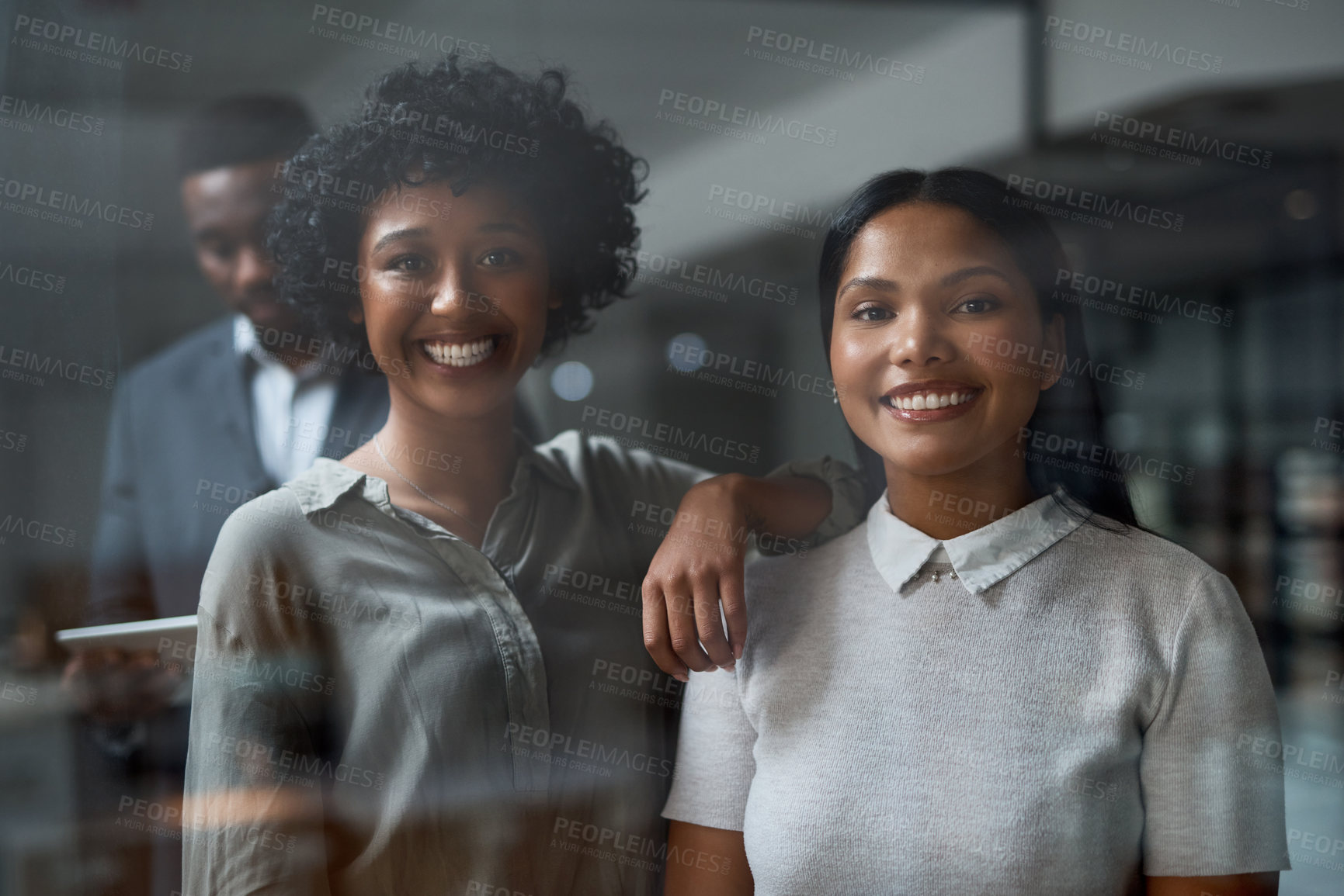 Buy stock photo Shot of three businesspeople working in a modern office