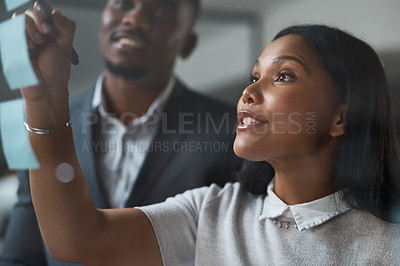 Buy stock photo Shot of Two businesspeople working in a modern office