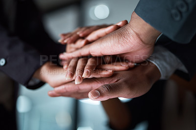 Buy stock photo Cropped shot of a group of unrecognizable businesspeople joining their hands together in a huddle