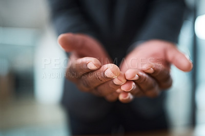 Buy stock photo Cropped shot of an unrecognizable businessman standing with his hands cupped together
