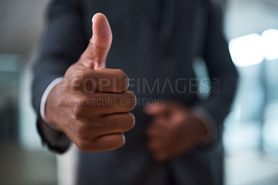 Buy stock photo Cropped shot of an unrecognizable businessman Showing thumbs up in an office