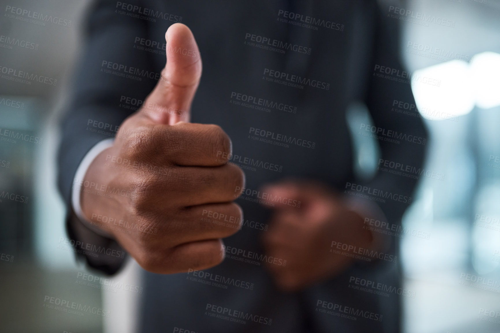 Buy stock photo Cropped shot of an unrecognizable businessman Showing thumbs up in an office
