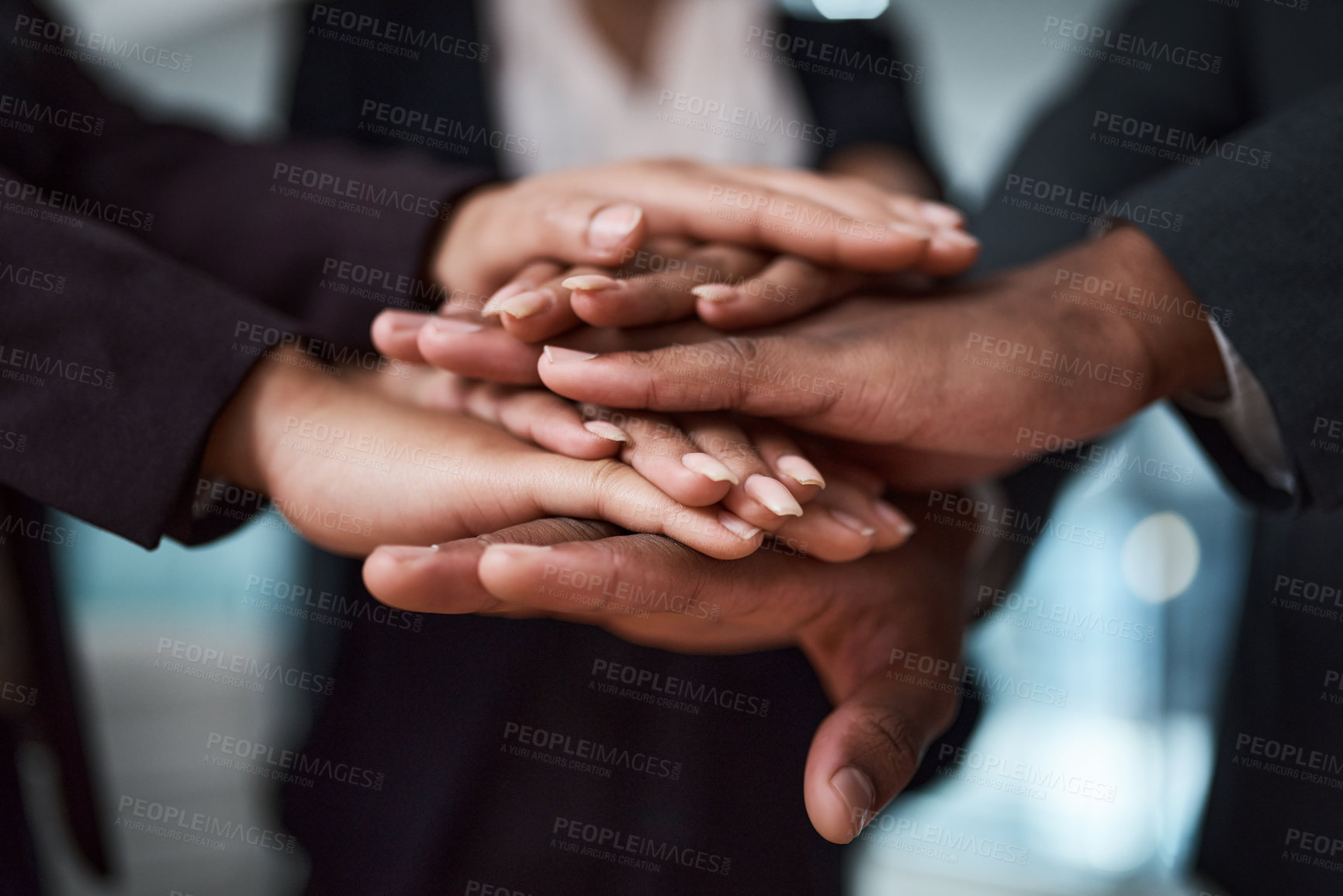 Buy stock photo Cropped shot of a group of unrecognizable businesspeople joining their hands together in a huddle