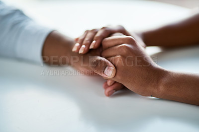 Buy stock photo Cropped of two unrecognizable people holding hands inside of the office during the day