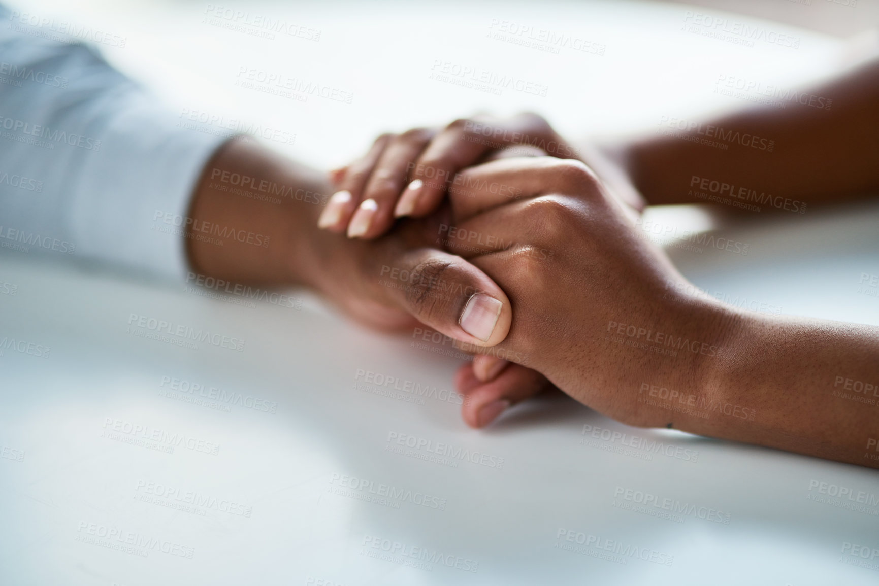 Buy stock photo Cropped of two unrecognizable people holding hands inside of the office during the day