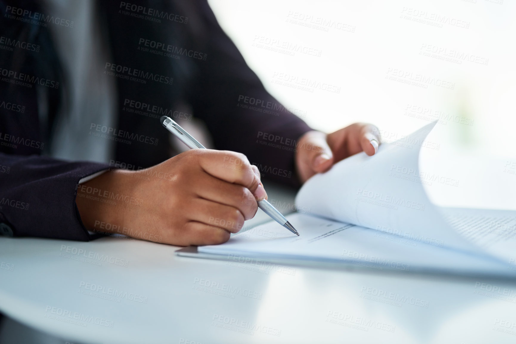 Buy stock photo Cropped shot of a businessman filling in paperwork in an office