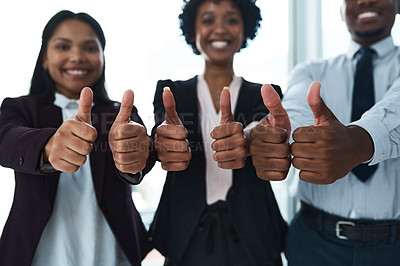 Buy stock photo Cropped shot of a group of unrecognizable businesspeople showing thumbs up in an office