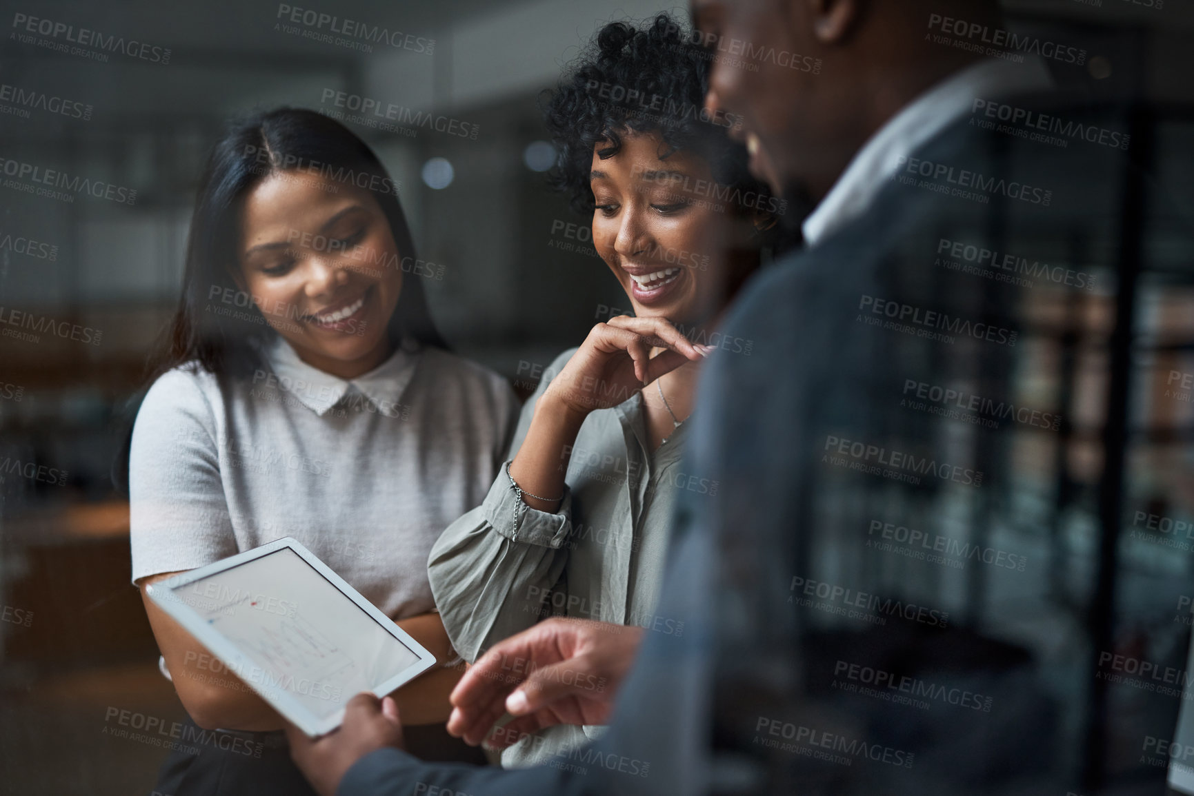 Buy stock photo Shot of three businesspeople working in a modern office