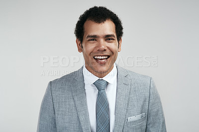 Buy stock photo Studio shot of a confident businessman standing against a grey background