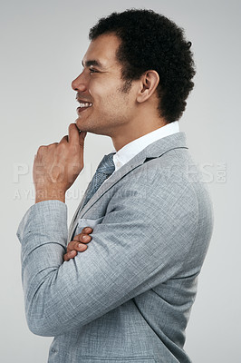Buy stock photo Studio shot of a businessman looking thoughtful while standing against a grey background