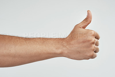 Buy stock photo Cropped shot of an unrecognizable man showing thumbs up