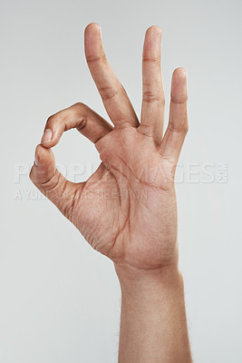 Buy stock photo Cropped shot of an unrecognizable man showing the ok sign