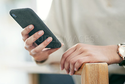 Buy stock photo Closeup shot of an unrecognisable businesswoman using a cellphone in an office