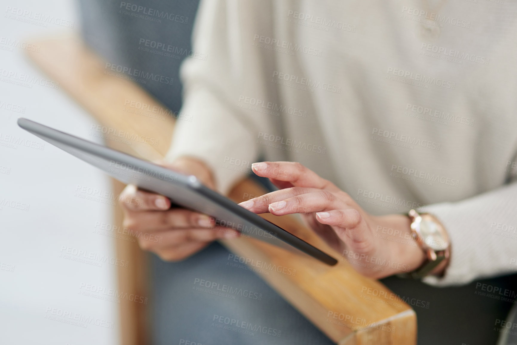 Buy stock photo Closeup shot of an unrecognisable businesswoman using a digital tablet in an office