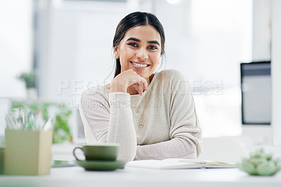 Buy stock photo Portrait of a confident young businesswoman working in an office