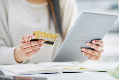 Buy stock photo Closeup shot of an unrecognisable businesswoman using a digital tablet and credit card in an office