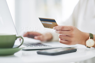 Buy stock photo Closeup shot of an unrecognisable businesswoman using a laptop and credit card in an office