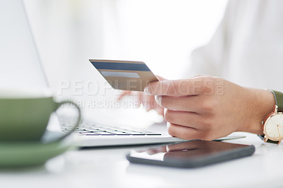 Buy stock photo Closeup shot of an unrecognisable businesswoman using a laptop and credit card in an office