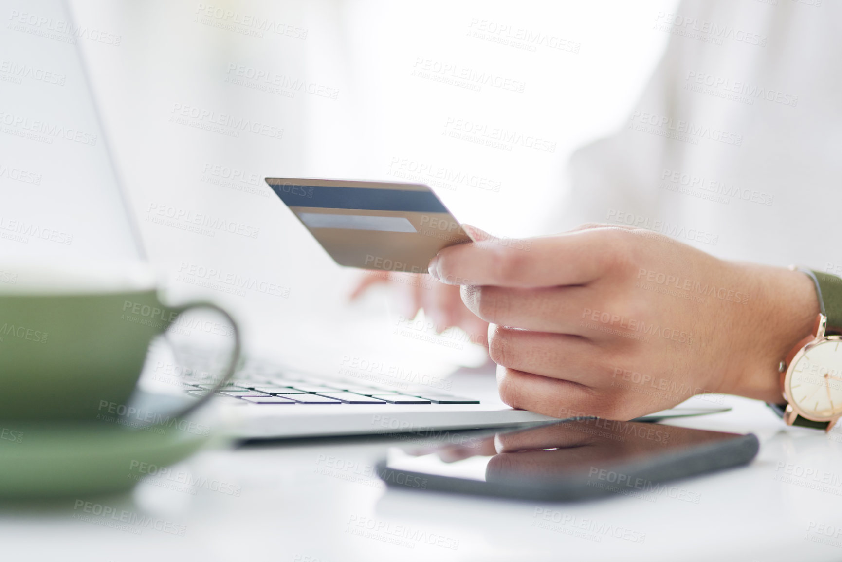 Buy stock photo Closeup shot of an unrecognisable businesswoman using a laptop and credit card in an office