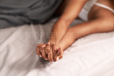 Buy stock photo Shot of an unrecognisable couple being intimate in their bedroom