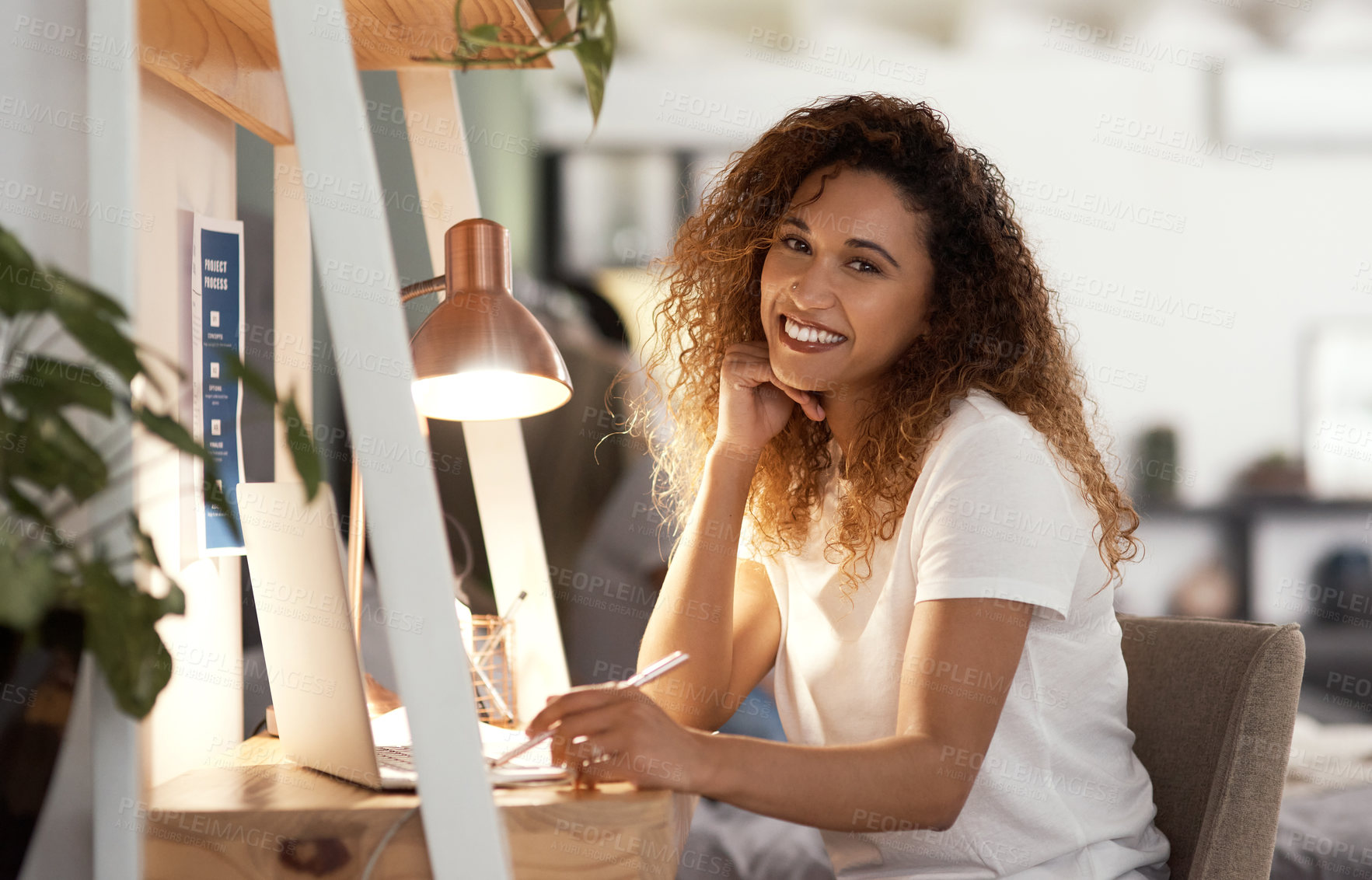 Buy stock photo Shot of a young woman using a laptop at in the lounge home