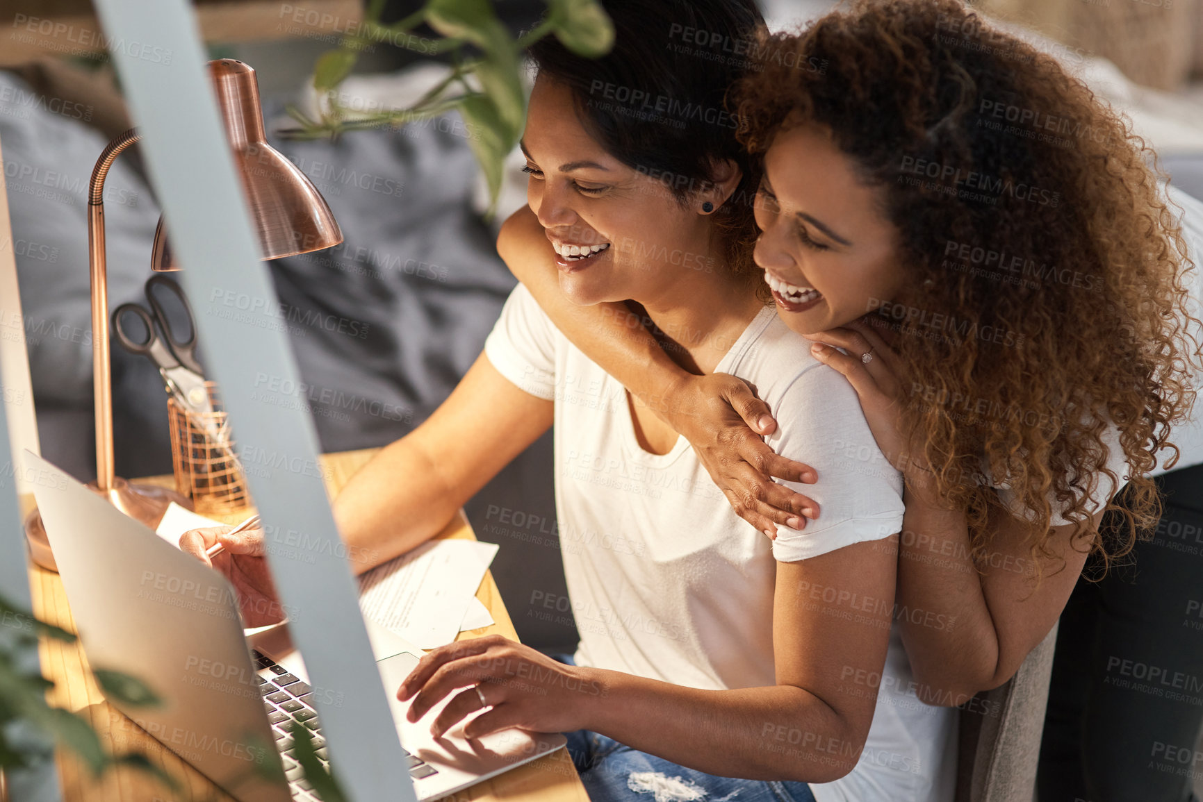 Buy stock photo Shot of a couple using a laptop in the lounge at home