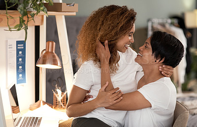 Buy stock photo Shot of a lesbian couple staring into each others eyes at home