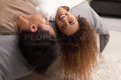 Buy stock photo Shot of a young lesbian couple relaxing in their bedroom at home