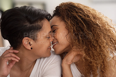 Buy stock photo Shot of a couple sharing a intimate moment in bed at home