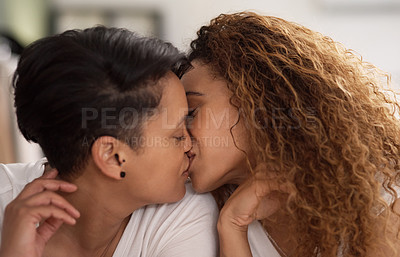 Buy stock photo Shot of a couple sharing a intimate moment in bed at home