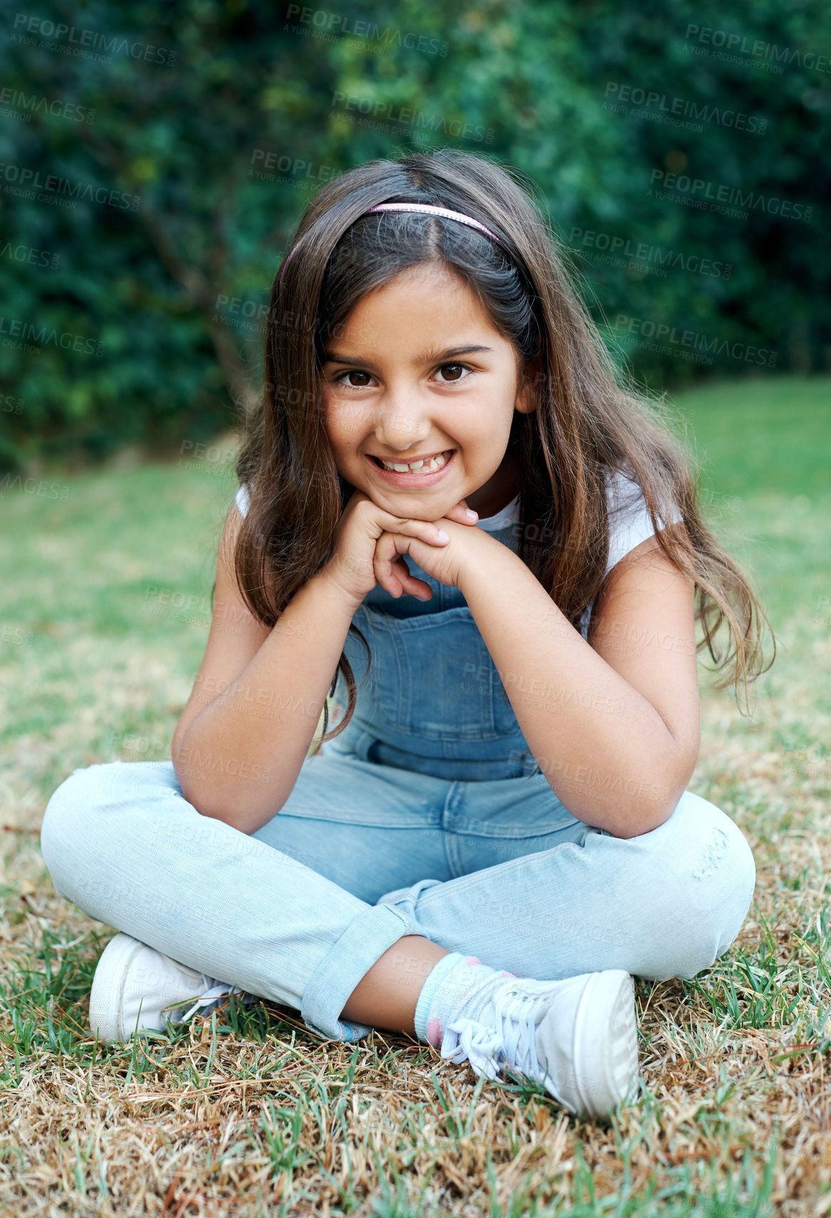 Buy stock photo Relax, smile and portrait of kid in garden for outdoor adventure, holiday and summer vacation. Child, little girl and joyful by green grass on lawn for break, happiness and weekend fun in park