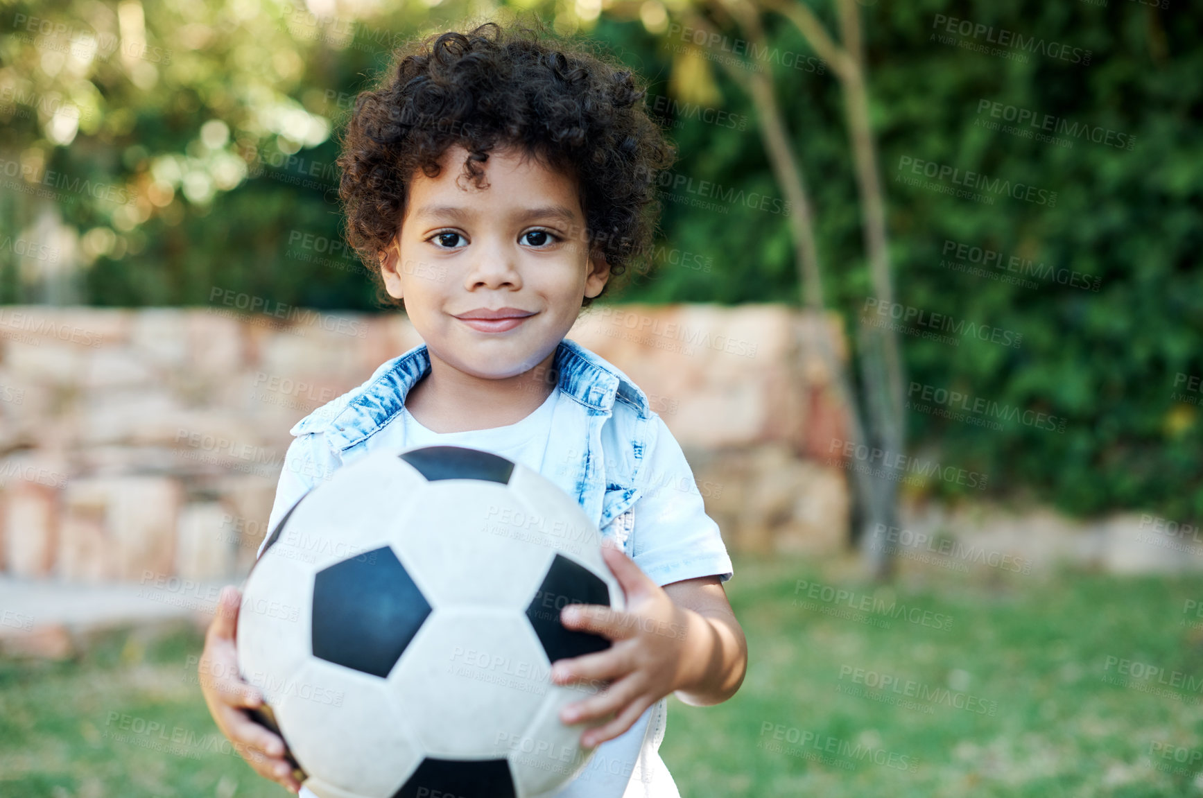 Buy stock photo Boy, portrait and soccer ball in backyard garden for playing games or learning sports, weekend or grass. Kid, happy and face or childhood development for exercise fun on playground, park or hobby