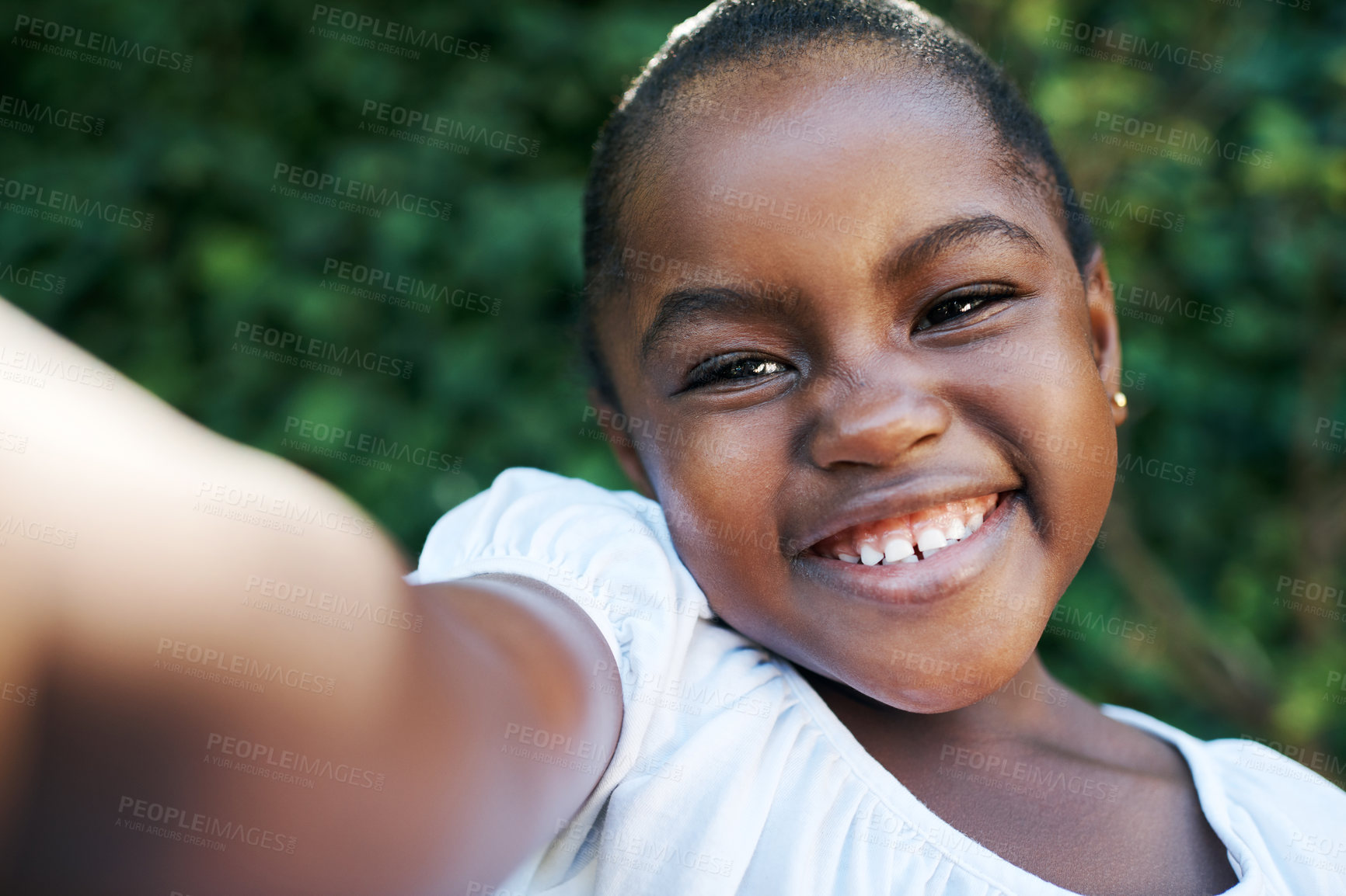 Buy stock photo Small girl, happy and selfie outdoor for fun, surprise and summer memory at friends birthday party. Black child, smile and photo in garden or backyard for vacation, holiday or playful joke with teeth