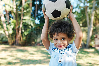 Buy stock photo Boy, portrait and soccer ball in garden park for playing games or learning sports, weekend or grass. Kid, happy and face or childhood development for exercise fun on playground, strength or hobby