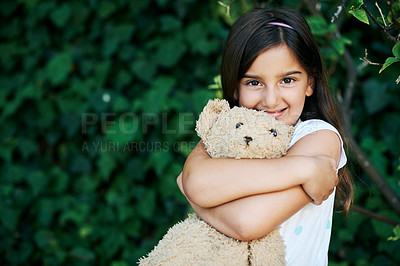 Buy stock photo Shot of a little girl standing outside with her teddybear