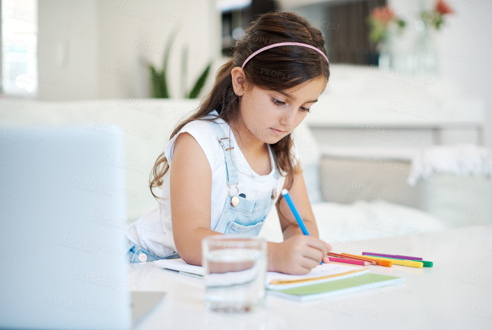 Buy stock photo Laptop, elearning and kid writing by desk in home for child development, homework and knowledge. Technology, drawing and student in virtual class with computer for online distance education at house.