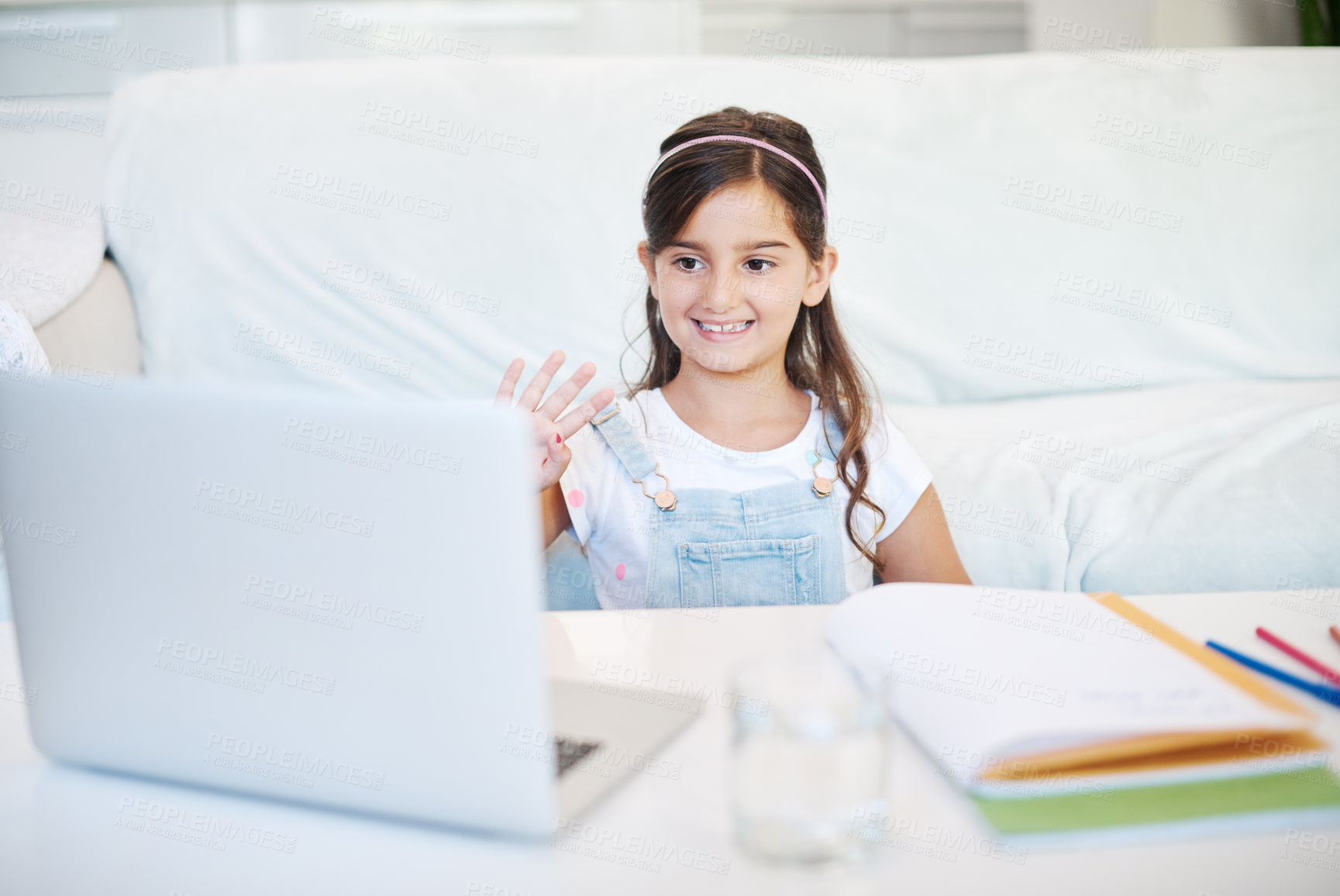 Buy stock photo Laptop, elearning and child by desk in home for development, homework and knowledge. Technology, greeting and girl student in virtual class with computer for online distance education at house.