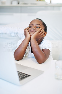 Buy stock photo Shot of a little girl looking bored at home
