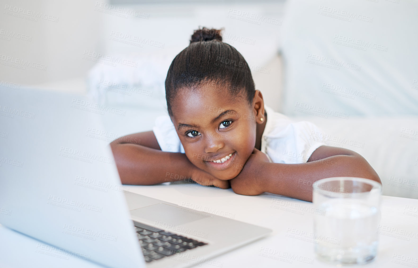 Buy stock photo Shot of a little girl using a laptop at home