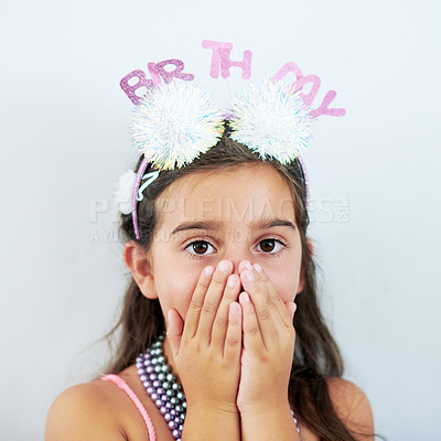 Buy stock photo Child, portrait and surprise hands at birthday party on white background in studio, excited or milestone. Girl, kid and face for celebration event or wow for youth omg with shock gesture or headband