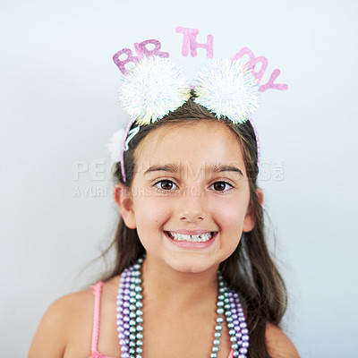 Buy stock photo Girl, birthday and portrait with smile, wall and celebration with party on special day. Child, hair hat and happiness or positive with excited facial expression, happy and getting older in America