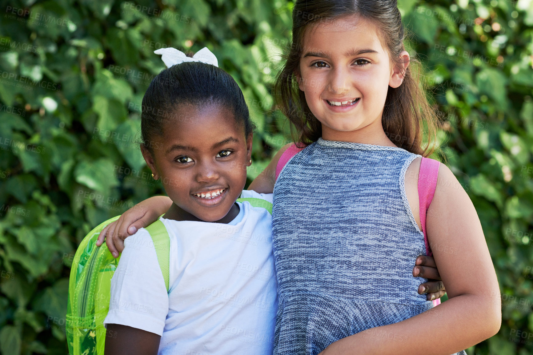 Buy stock photo Shot of two little girls wearing backpacks outside in nature