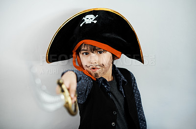 Buy stock photo Shot of a little boy wearing a pirate costume against a white background