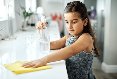 Buy stock photo Cloth, cleaning and girl child with spray bottle for kitchen counter with hygiene to prevent dirt, bacteria or dust. Detergent, wipe and kid washing or sanitizing table for housekeeping at home.